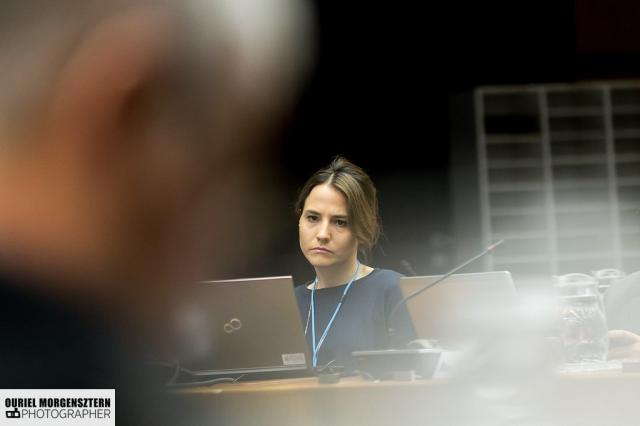 a person standing in front of a laptop