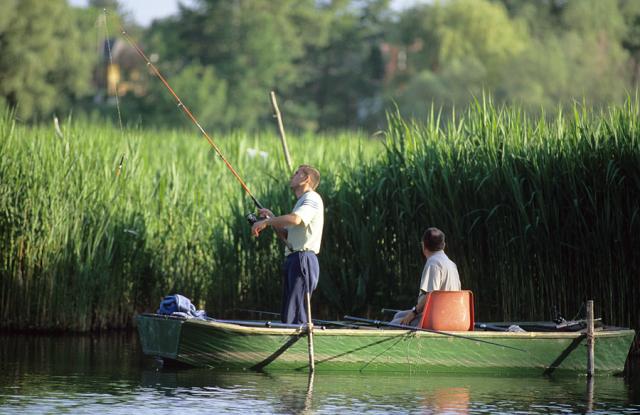 a man riding on the back of a boat