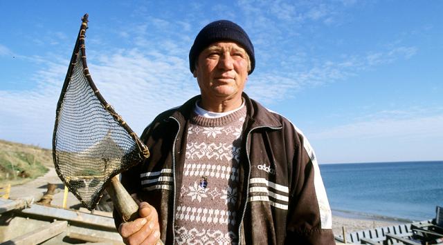 a man holding a fish net