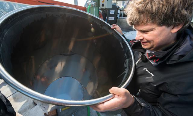 a man holding a pot