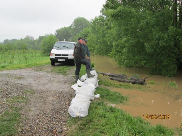 a man walking down a dirt road