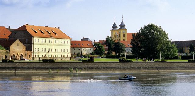 a building next to a body of water