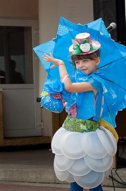 a little girl wearing a blue hat