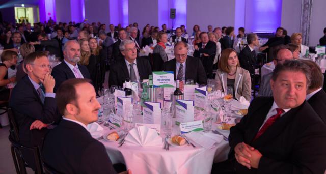 a group of people sitting at a table