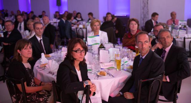 a group of people sitting at a table