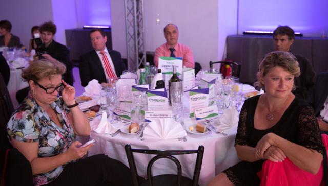 a group of people sitting at a table