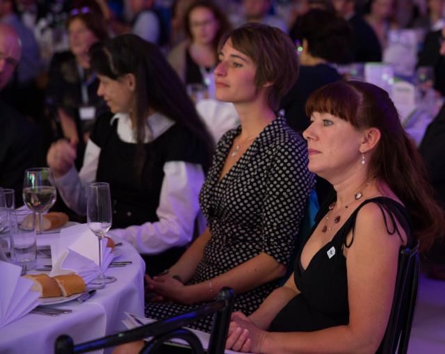 a group of people sitting at a table