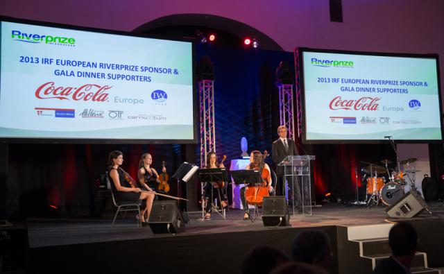 a group of people performing on stage in front of a store