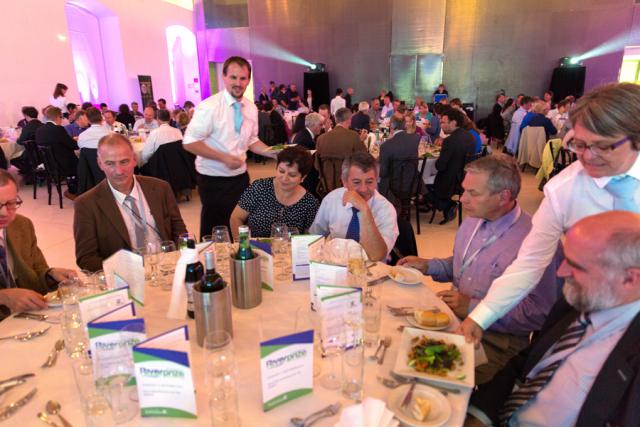 a group of people sitting at a table