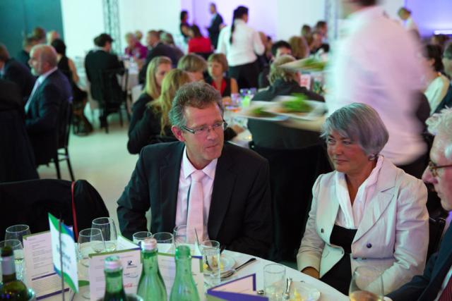 a group of people sitting at a table