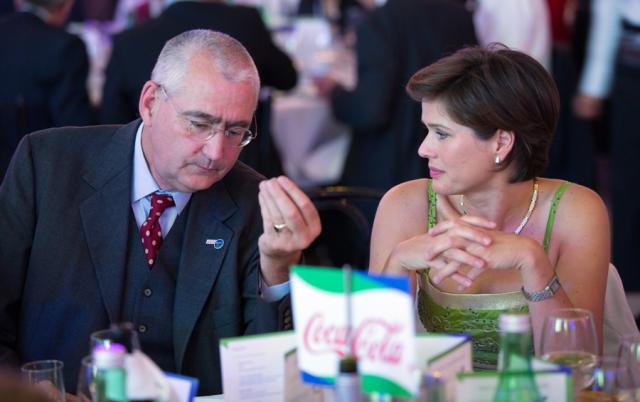 a couple of people sitting at a table