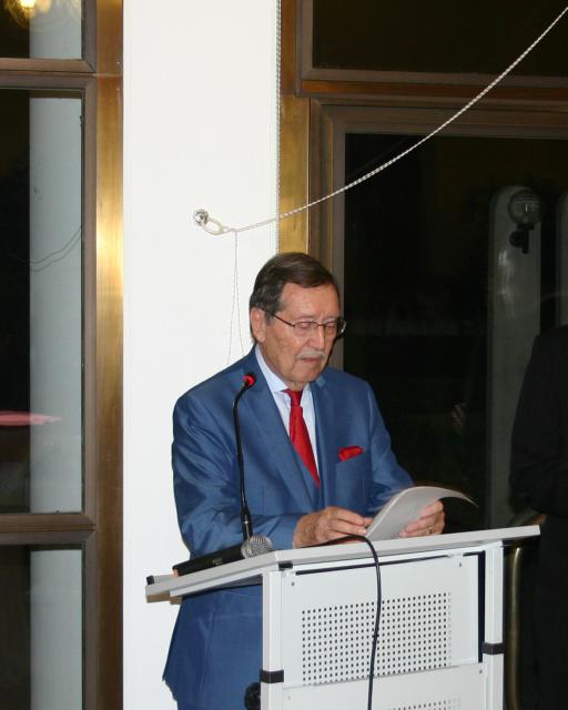 a man standing in front of a computer