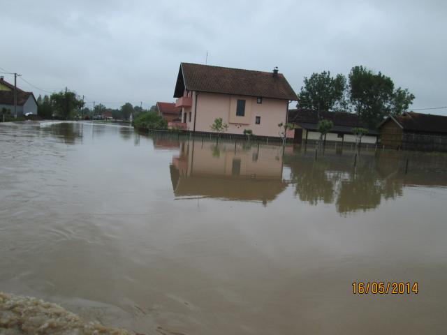 a house next to a body of water