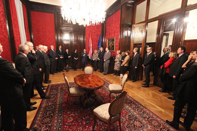 a group of people sitting at a table in a room