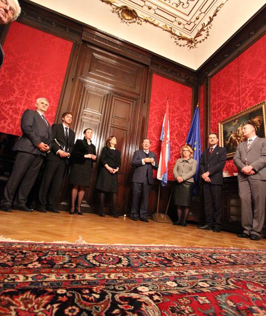 a group of people standing on a rug