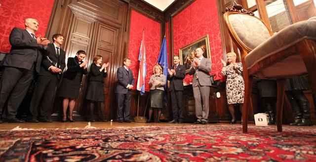 a group of people standing on a rug