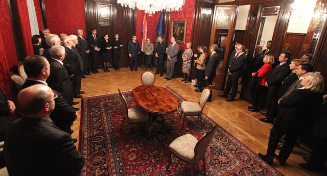 a group of people sitting at a table in a room