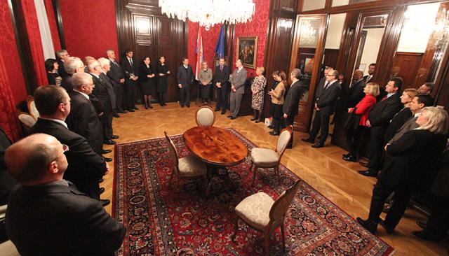 a group of people sitting at a table in a room