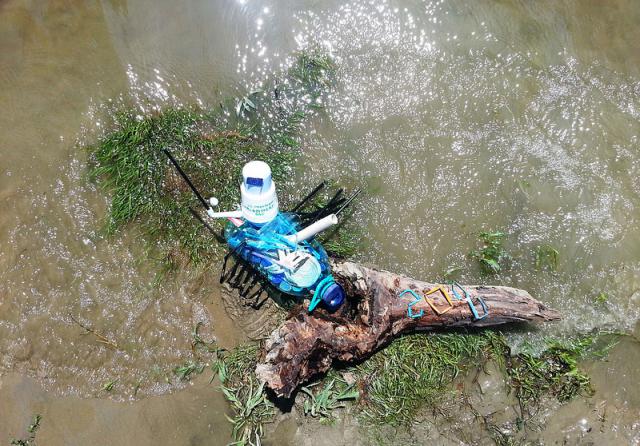 a person sitting on a raft in a body of water