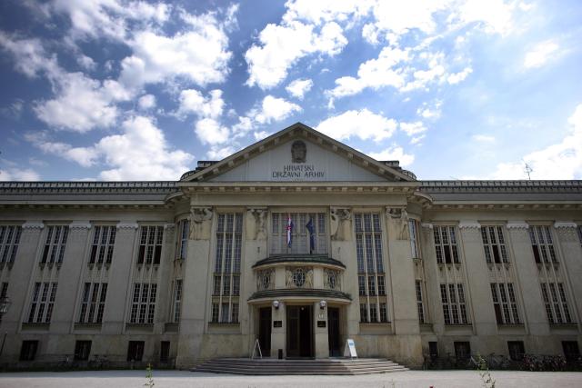 a large clock tower in front of a building