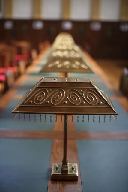 a clock sitting on top of a wooden table