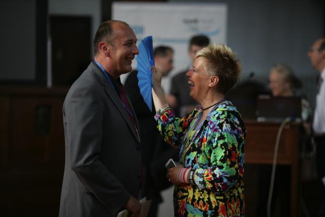 a man and a woman standing in a room