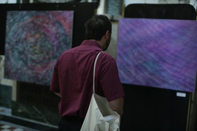 a man standing in front of a computer screen