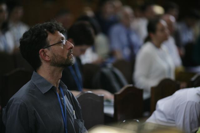 a man standing in front of a crowd