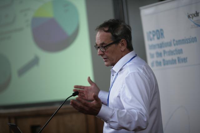 a man standing in front of a microphone