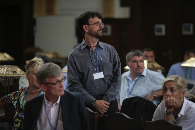 a man standing in front of a crowd