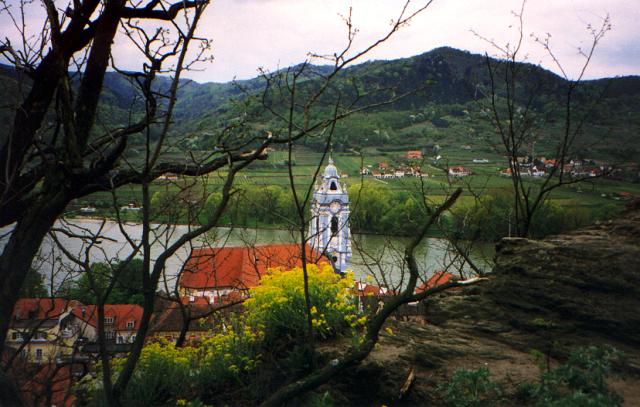 a church behind trees 