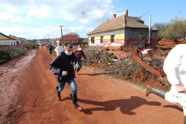 People running away from a village