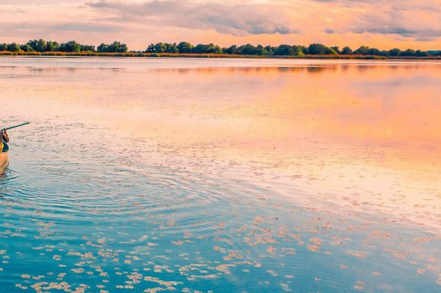 Sunset on the water in Romania