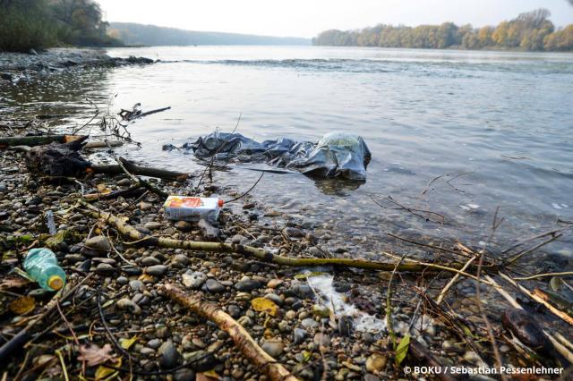 Plastic litter at a riverbank of the Danube, including plastic bottles and other plastic waste