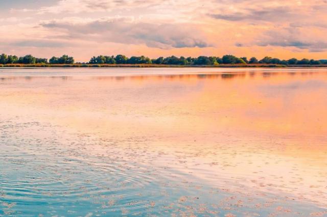 Sunset on the water in Romania