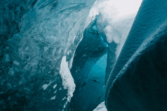 a lot of ice on a glacier that is melting down 