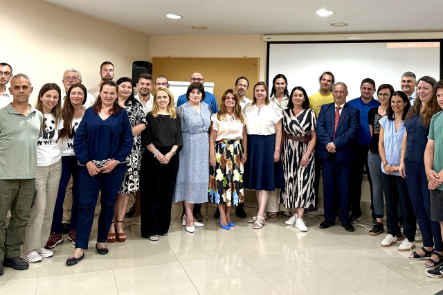 A group photo of people at a conference