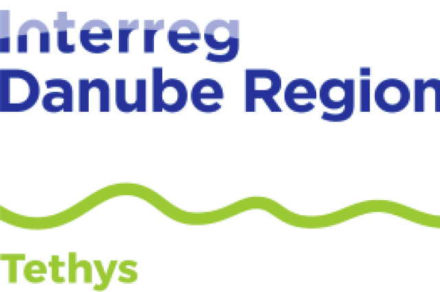 A logo with a green wave above which is written: Interreg Danube Region and below Tethys, with an EU floafg on the right side