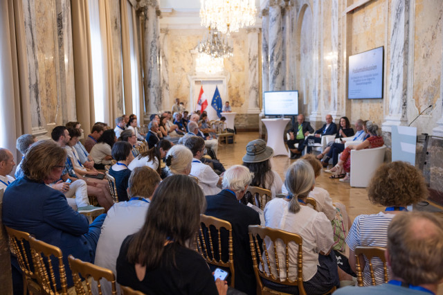 The public watching a podium discussion