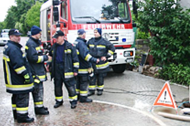 a group of firefighters with a truck