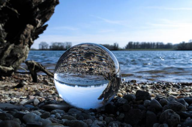 a rocky beach next to a body of water