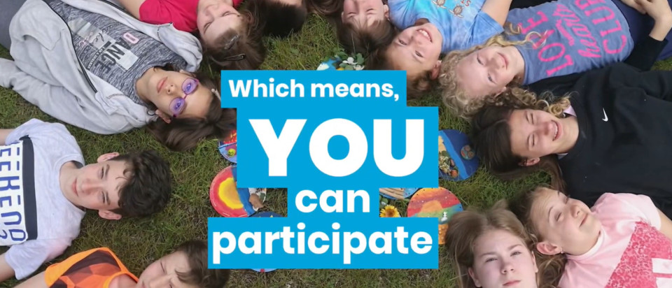 Image of teens laying on the grass, with a text that says: 'which means you can particpate'